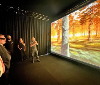 People watch a 3D immersive demonstration of fire conditions