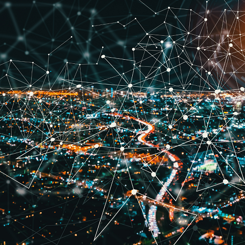 City lights overlaid with a network diagram