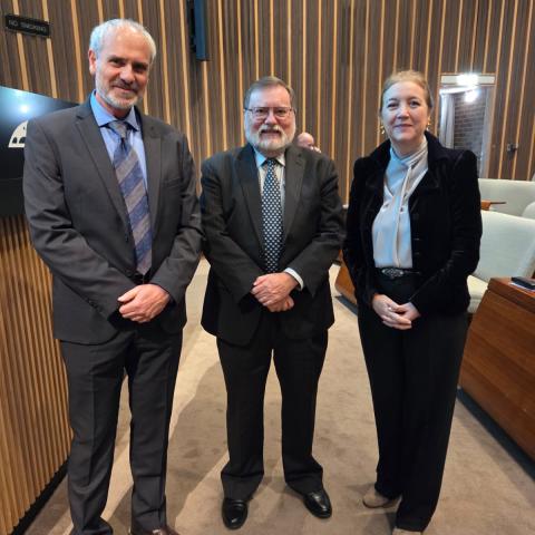 Prof Tony Haymet stands with Dr Josep 'Pep' Canadell and Her Excellency Esther Monterrubio Villar