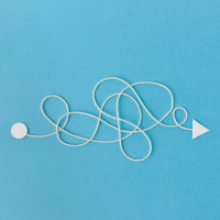 Loosely curled piece of string with a circle at one end and an arrow at the other