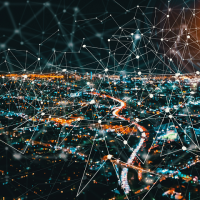 City lights overlaid with a network diagram